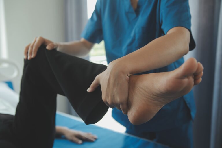 physiotherapist-working-with-patient-clinic-closeup